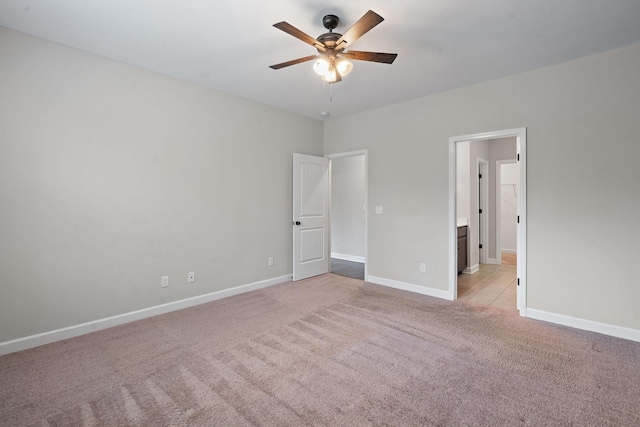 unfurnished bedroom with light colored carpet and ceiling fan