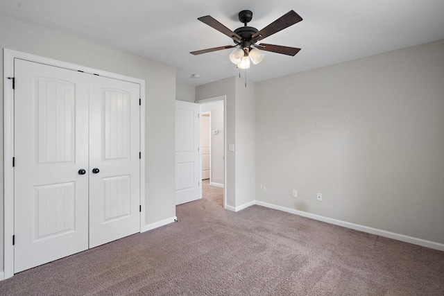 unfurnished bedroom featuring a closet, ceiling fan, and carpet floors