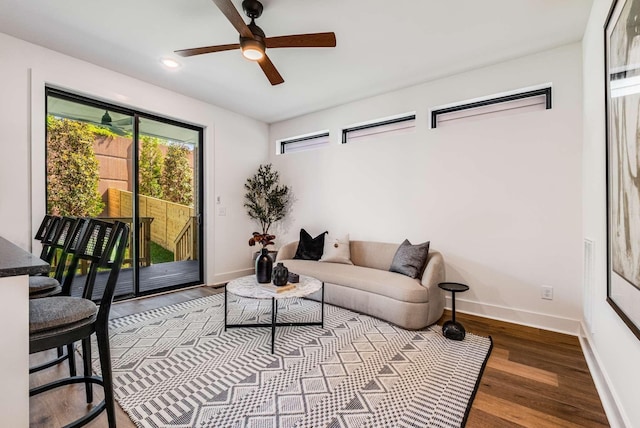 living area featuring dark wood-style flooring, recessed lighting, a ceiling fan, and baseboards