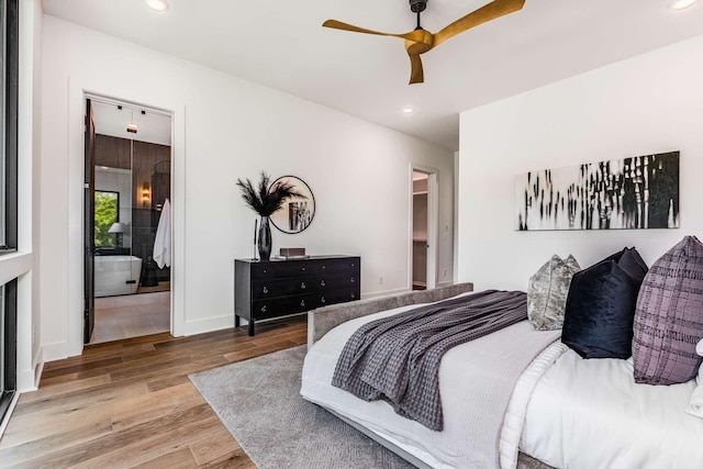 bedroom featuring baseboards, wood finished floors, a ceiling fan, and recessed lighting