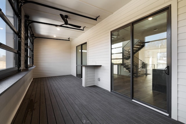 wooden deck with ceiling fan