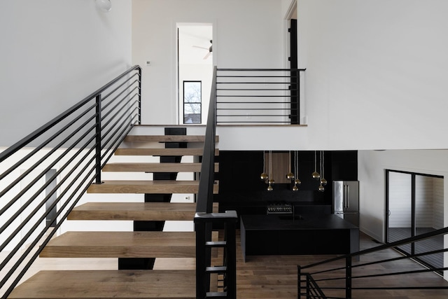 stairway featuring wood finished floors