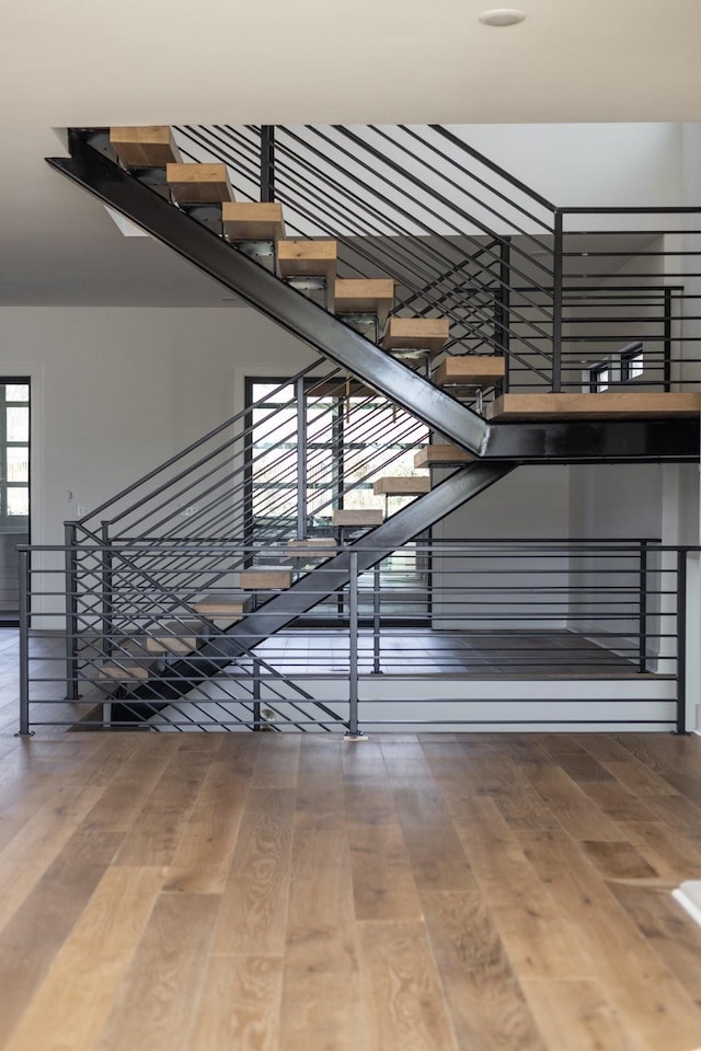 staircase featuring wood finished floors