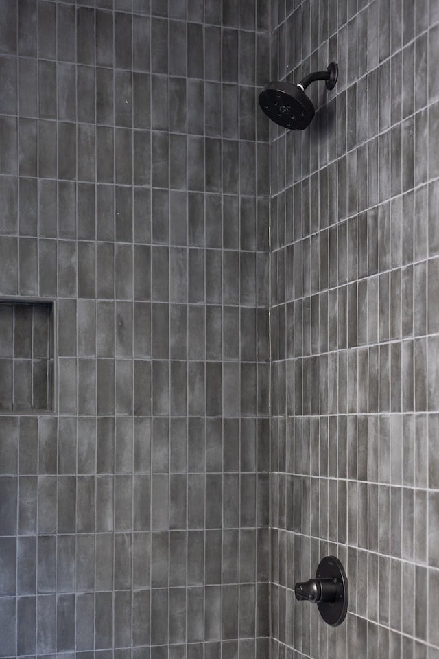 room details with a tile shower