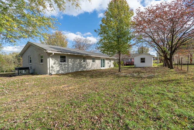 985 Watauga Dr, Cookeville, TN 38501 - rear view of property with central air condition unit and a lawn
