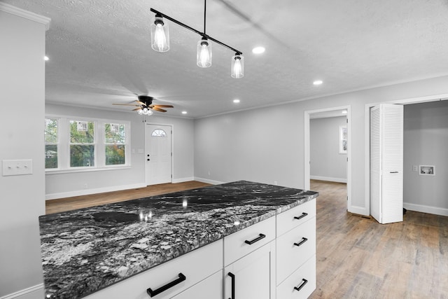 985 Watauga Dr, Cookeville, TN 38501 - kitchen with ceiling fan, a textured ceiling, white cabinetry, pendant lighting, and dark stone counters