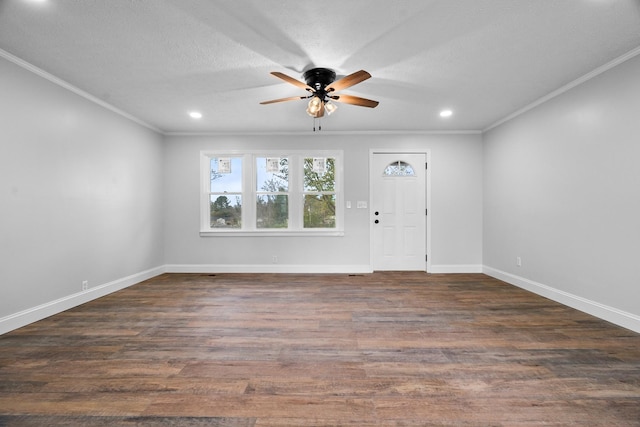 foyer featuring ceiling fan, crown molding, dark hardwood / wood-style floors, and a textured ceiling