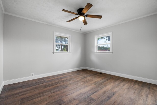 985 Watauga Dr, Cookeville, TN 38501 - spare room featuring a wealth of natural light, ornamental molding, and dark hardwood / wood-style floors