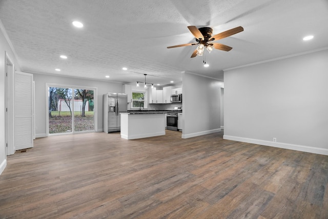 985 Watauga Dr, Cookeville, TN 38501 - kitchen featuring decorative light fixtures, hardwood / wood-style flooring, white cabinetry, a center island, and stainless steel appliances
