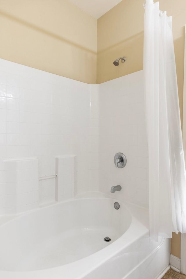 bathroom featuring shower / bath combo with shower curtain