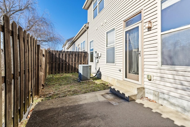 exterior space with central AC and a patio