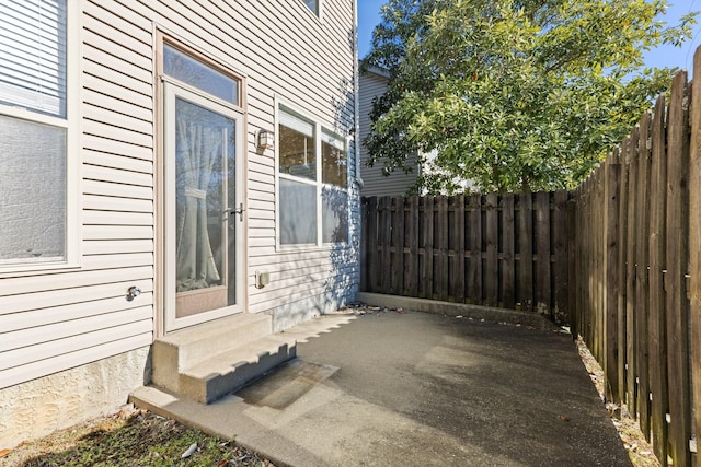 view of side of property featuring a patio