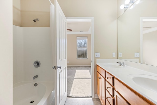 bathroom featuring shower / bath combo and vanity