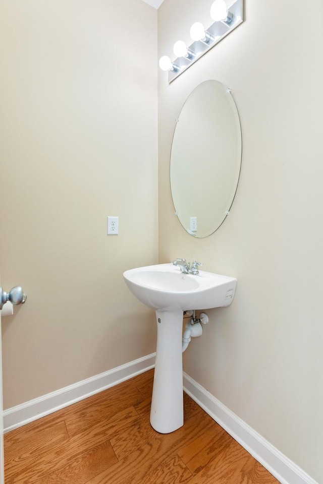 bathroom with wood-type flooring