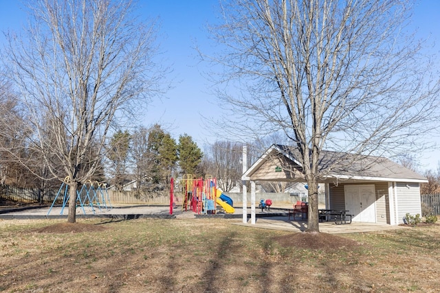 view of yard with a playground and a patio