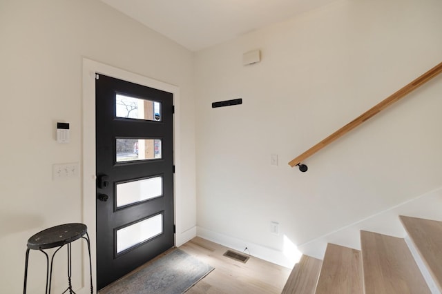 entryway with light hardwood / wood-style floors