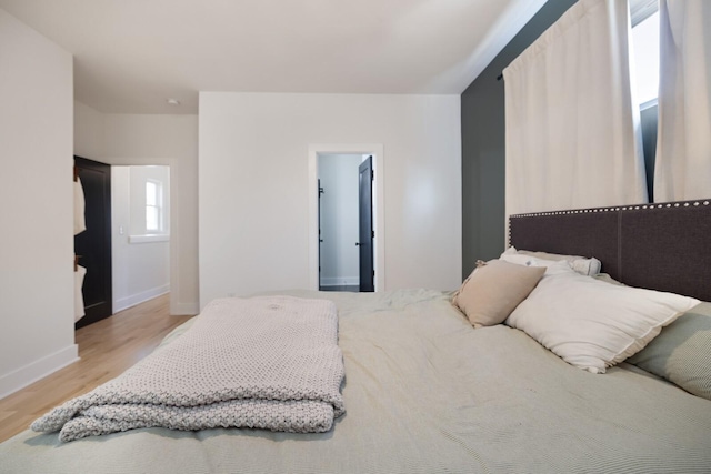 bedroom featuring light wood-type flooring