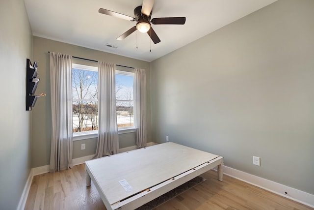 bedroom featuring ceiling fan and light hardwood / wood-style flooring