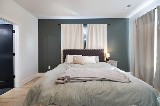 bedroom with light wood-type flooring