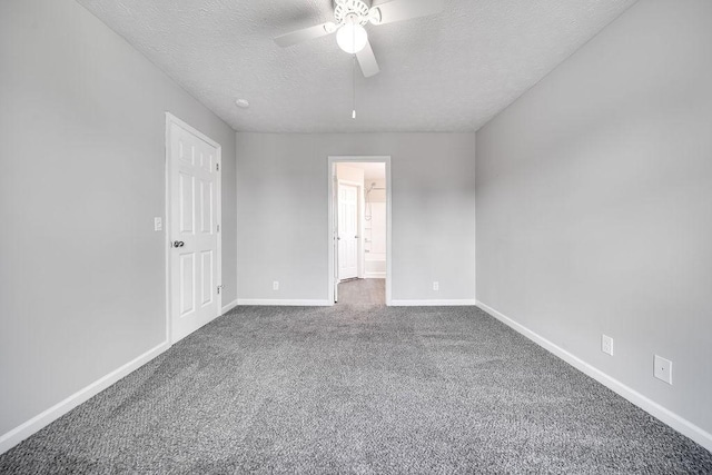 unfurnished bedroom featuring a textured ceiling, carpet floors, connected bathroom, and ceiling fan