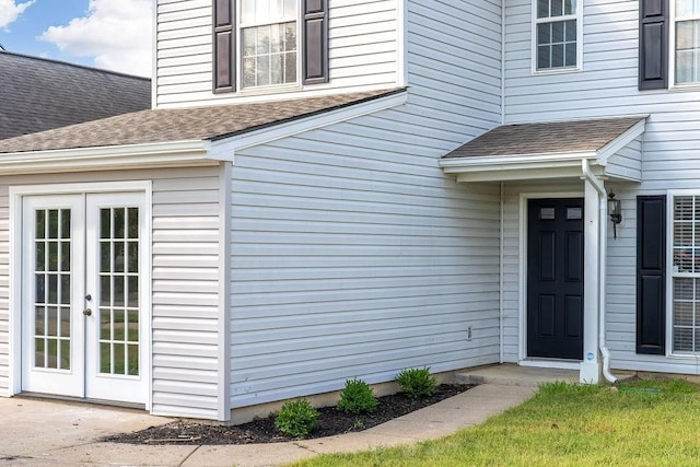 view of exterior entry featuring french doors