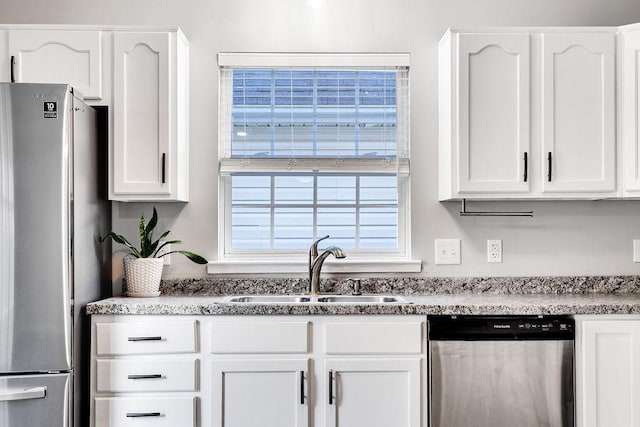 kitchen featuring sink, white cabinetry, and appliances with stainless steel finishes