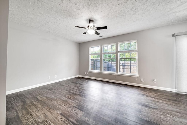 unfurnished room with ceiling fan, a textured ceiling, and dark hardwood / wood-style floors