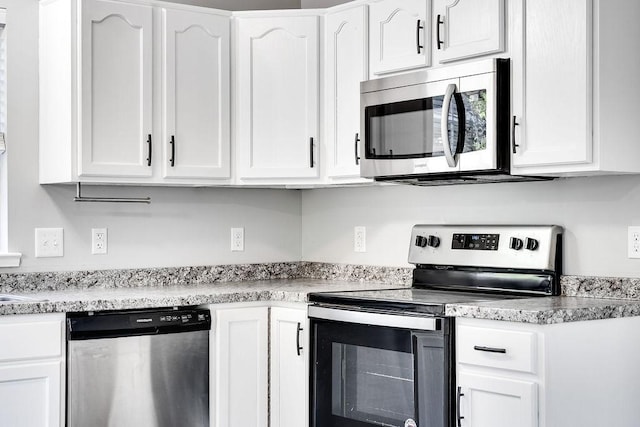 kitchen with white cabinetry and stainless steel appliances