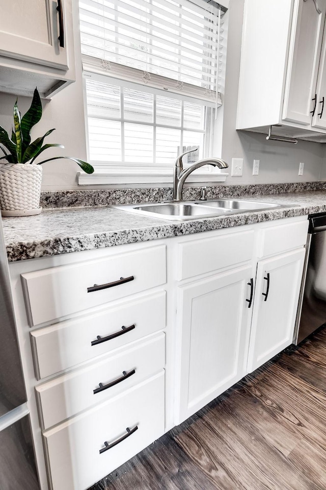 kitchen featuring sink, white cabinets, dishwasher, and dark hardwood / wood-style flooring