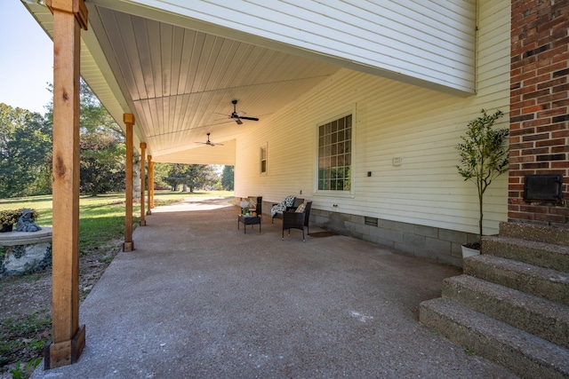 view of patio featuring ceiling fan