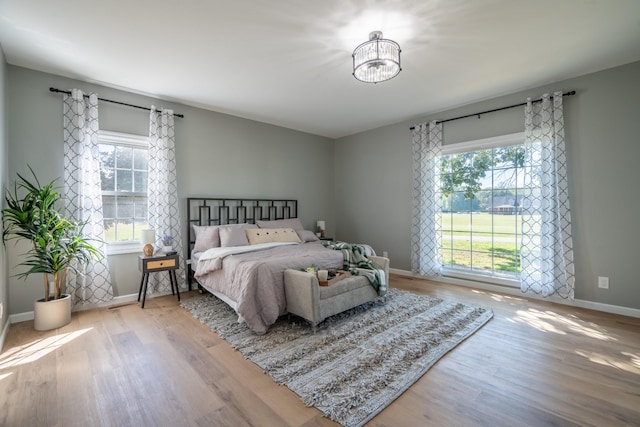 bedroom with hardwood / wood-style floors