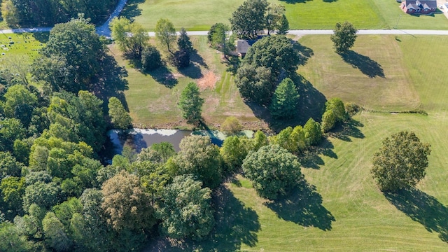 birds eye view of property with a rural view