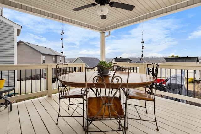 wooden terrace featuring ceiling fan