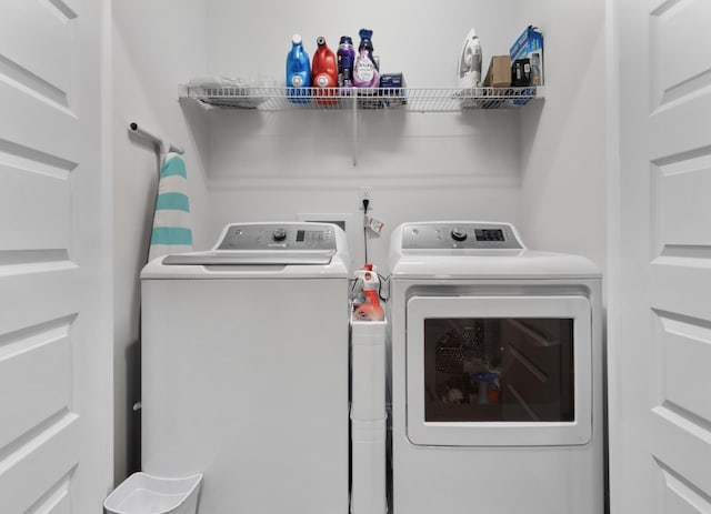 washroom with washer and clothes dryer