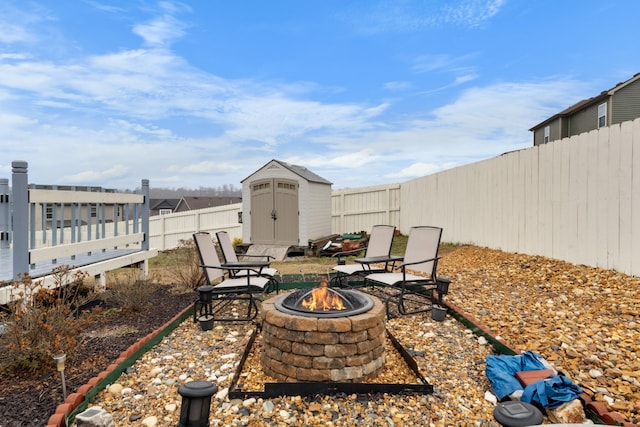 view of patio / terrace with an outdoor fire pit and a shed