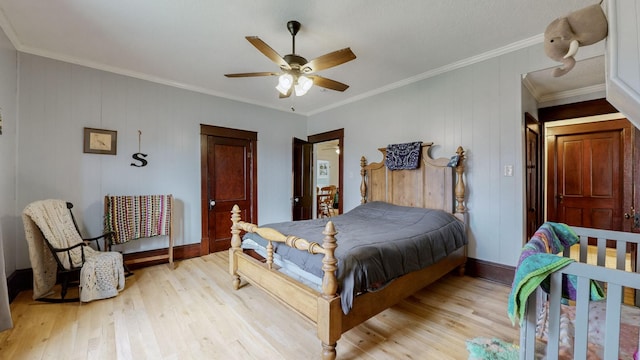 bedroom featuring ornamental molding, ceiling fan, and light hardwood / wood-style flooring