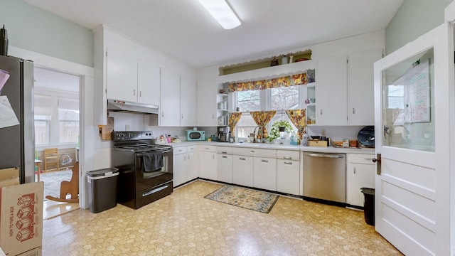 kitchen with sink, white cabinets, and stainless steel appliances