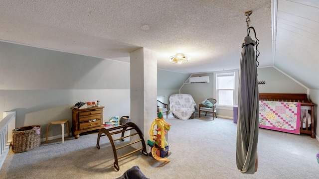 carpeted bedroom featuring a textured ceiling, lofted ceiling, and a wall mounted air conditioner