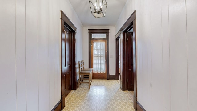 hallway with wood walls