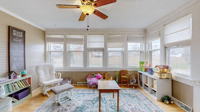 sunroom / solarium with ceiling fan