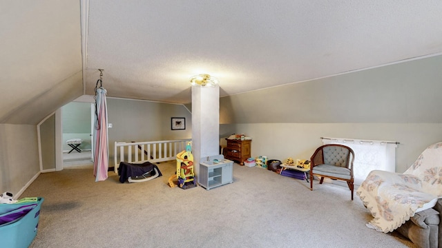 rec room with carpet floors, a textured ceiling, and lofted ceiling