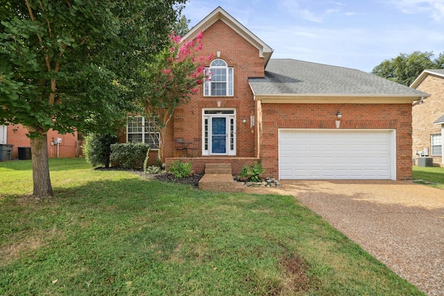 view of front property with a garage, a front yard, and central AC