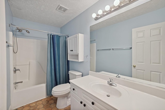 full bathroom featuring a textured ceiling, tile patterned floors, vanity, shower / bath combination with curtain, and toilet