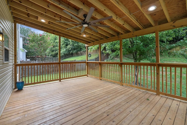 deck with ceiling fan and a yard