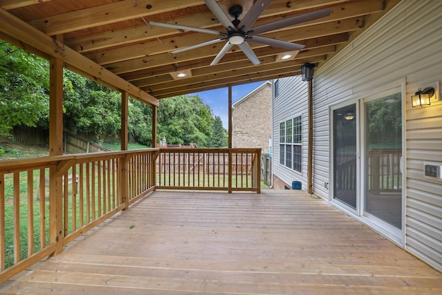 wooden terrace featuring ceiling fan