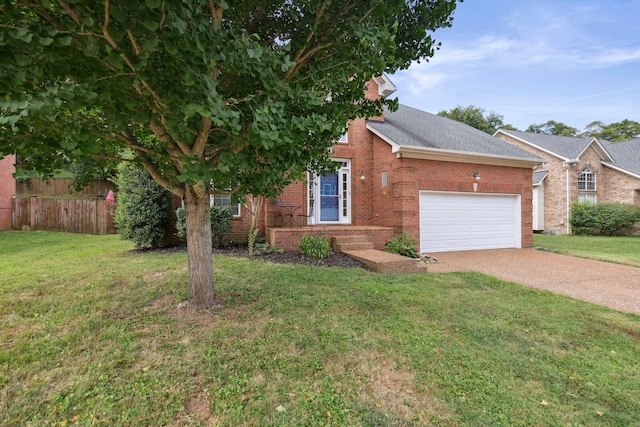 view of front of house featuring a garage and a front lawn