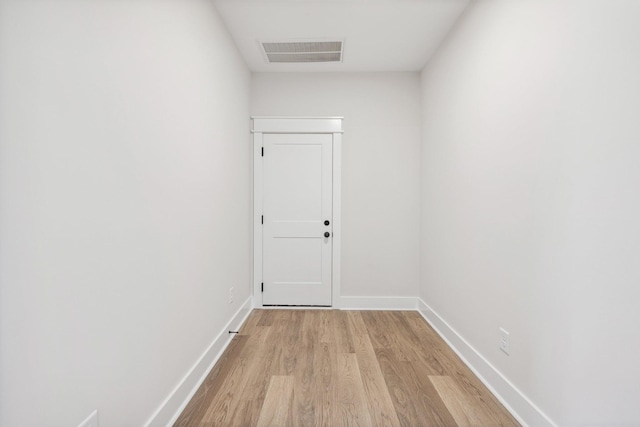 hallway with light wood-type flooring