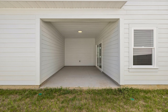 property entrance featuring a patio area