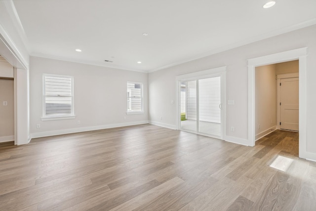 interior space with light wood-type flooring and crown molding