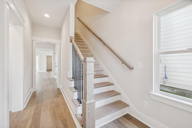 staircase featuring wood-type flooring